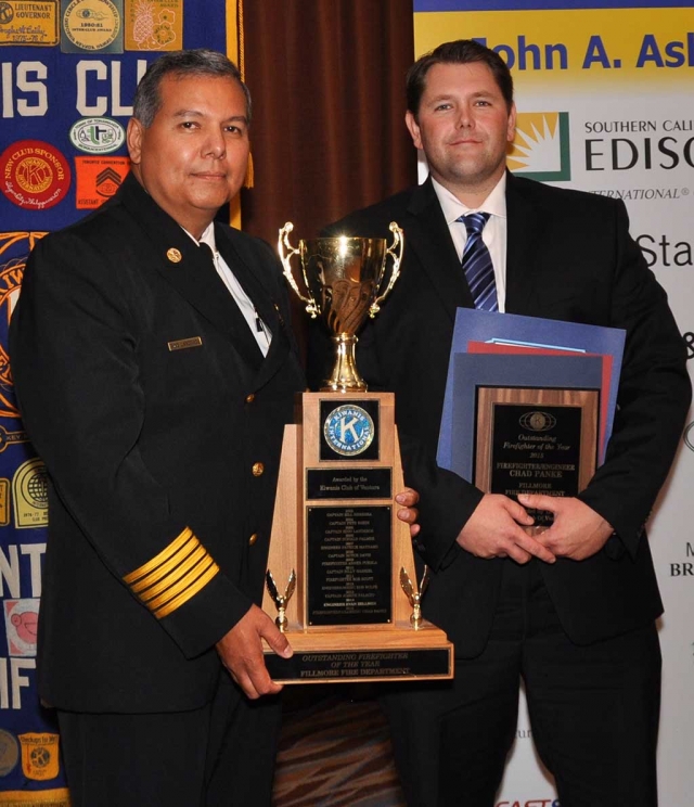 Fillmore Fire Chief Rigo Landeros presents Fillmore’s 2014 Firefighter of the Year Chad Panke with awards at the 13th Annual Firefighters & Heros Gala in Ventura, on September 11th.