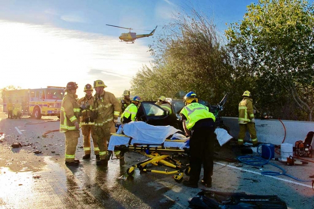 (above) On scene, Fillmore and Ventura County Fire Fighters extricated one woman from one of the vehicles involved in the three car collision. She and a second passenger were transported by helicopter to local hospital. A two-car crash, with a third car involved occurred on Highway 126 near Piru about 3:40 p.m. Tuesday. Reports by the California Highway Patrol state the accident was head-on. “Two people were trapped in the vehicles and were rescued about 4 p.m., according to Capt. Mike Lindbery, a spokesman for the Ventura County Fire Department.” “One person was pronounced dead at the scene and an investigator with the Ventura County Medical Examiner’s Office was called to the scene, Lindbery said.” Two persons were airlifted to a nearby hospital. The CHP reported that “the highway was closed for several hours but reopened just after 8 p.m.” Photos by Sebastian Ramirez.
