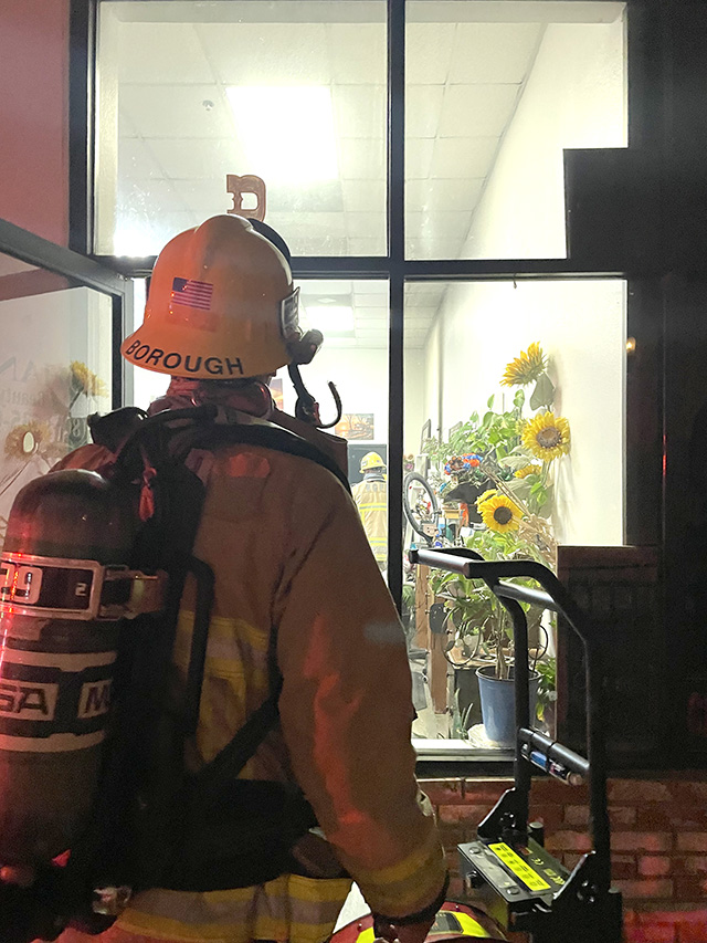 On Saturday, August 8th, at approximately 8:42 p.m., Fillmore City Fire, Ventura County Fire, and the Fillmore Police Department were dispatched to a reported structure fire in the 300 block of Central Avenue. Arriving firefighters located a business with smoke inside. Firefighters made access inside the building and located a burned wall. Crews opened the wall to make sure no active fire was burning. A fire investigator responded to the scene, and the cause of the fire is under investigation. Photo credit Angel Esquivel.