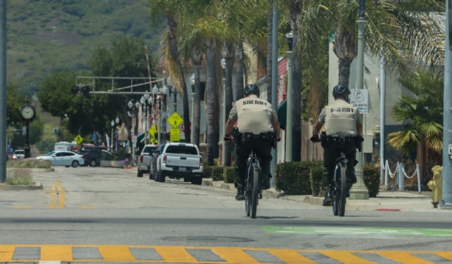 On Friday, June 23, 2023, Fillmore Sergeant Hollowell and Capitan Malagon were spotted near Central Avenue and Ventura Street patrolling the city with the brand-new E-Bikes that were purchase earlier this month. In April the Fillmore City Council voted (5-0) and approved the purchase of four E-Bikes to be used by the Fillmore Police Department. The E-Bikes will be used to augment uniformed patrol services throughout the city by allowing deputies to undertake bicycle patrols. They offer many benefits to the community, including high visibility, and engagement with community members. Patrolling on bicycles makes deputies more accessible and personable to the public and will help facilitate more proactive and positive police contacts with members of the community. Photo credit Angel Esquivel- AE News.