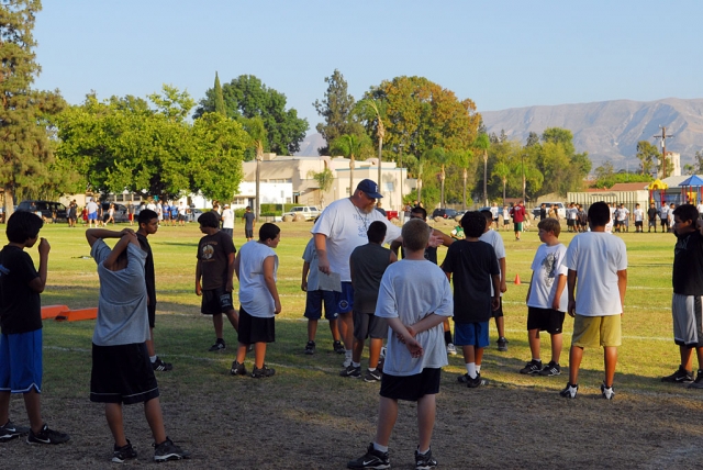 Fillmore Raiders Football started camp last week. Pictured above Joe Woods coach for J2’s is explaining a drill to the kids. This year the Raiders have 8 teams, Mighty Mights to J2’s.