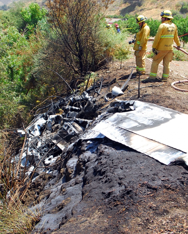 Fire crews remained on scene to extinguish several small brush fires ignited by the wreckage.