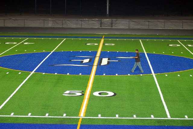 On Tuesday evening, the man above took light meter readings as he walked down the center of the new Fillmore High School football field. Photographers of night football and soccer games will be delighted with the greatly improved lighting environment.