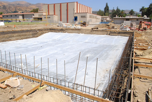 A different photo angle, looking East, of the swimming pool after the floor was poured.