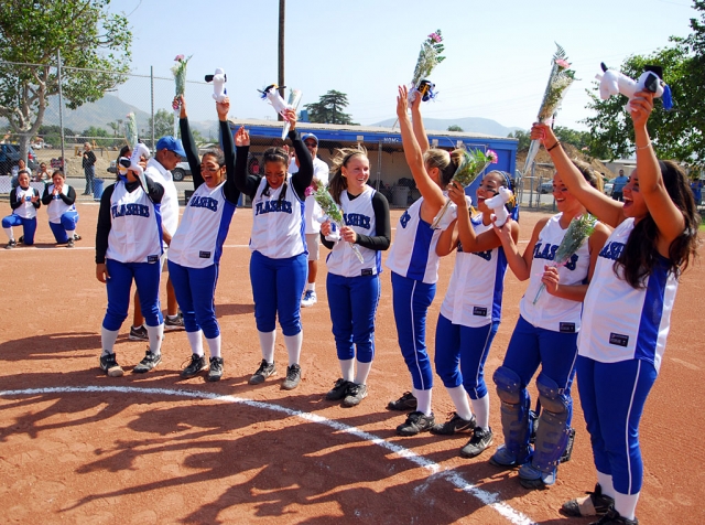 F.H.S. 2008 senior softball players were thanked and honored with flowers by their coaches Eddie Ortiz and John Ortiz also Ashley Gongora and Brenda Hampton-Ortiz, who helped out during the season, at the beginning of their final game of the season. Senior girls are (l-r) Noelle Hernandez, Tenea Golson, Brianna Rojo, Ashley Grande, Tiffany Gonzales, Alle Davis, Shannon Carpenter and Jessica Gonzalez.