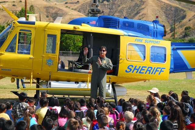Ventura County Helicopter Pilot K.B. Bergeson visited San Cayetano Elementary in a Search & Rescue Copter, May 27th. The students were excited to see the big bird land on the back lawn and even more thrilled to be able to climb through the copter. Bergeson answered all kinds of questions and explained the copter’s functions. According to Principal Jan Marholin, some of the students have been studying rotor motors and this firsthand look at the copter was a real education.