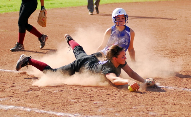 Ashley Grande is safe at third after sliding. Lady Flashes played Santa Paula and beat them 9-5.