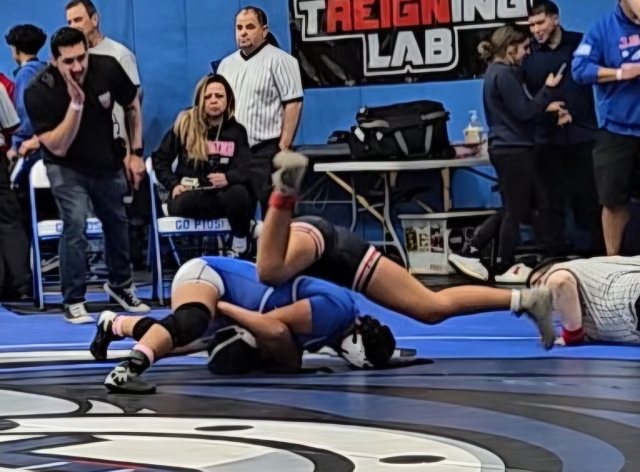 On Saturday, January 4, Fillmore’s Emma Torres in blue above is taking down her opponent Iolana Yandall from Banning High School at the 2025 Lady Pioneer Girls Wrestling Tournament. Inset, Flashes Skyla Sandoval, Emma Torres, Naomi Bonilla, Ava Manzano who medaled in the Tournament. Photos by Girls Head Coach Michael Torres.