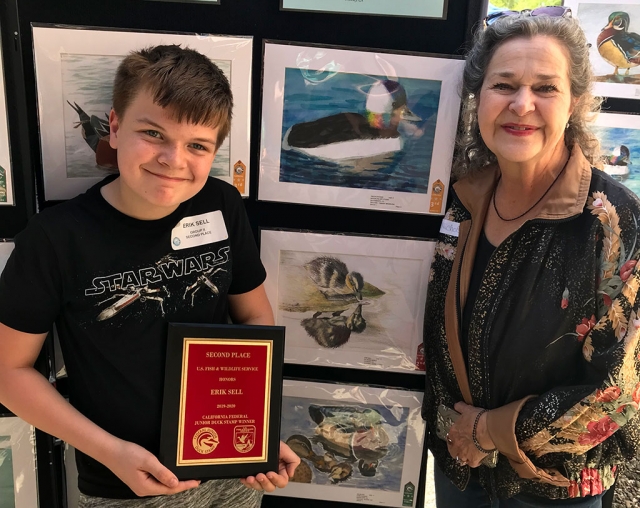 On Saturday, May 4th, a ceremony was held at the Sacramento Wildlife Refuge where Fillmore’s Eric Sell won second place in his age category, one of nine students to do so in the State, chosen from 2,500 entries. His father, David Sell, mother Krista Ward-Sell, his brother Ethan Sell and his grandmother, Joan Ward (not pictured), together with Mrs. Nichols (right), also traveled to the Sacramento Wildlife Refuge to show support for the students.