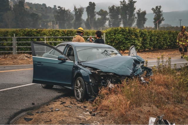 On Monday, June 5th, at 8:20am, Ventura County Fire Department, AMR Paramedics, and California Highway Patrol were dispatched to a reported traffic collision on SR23 / Elkins Road, Bardsdale. Arriving firefighters found a truck with a trailer attached and a blue Audi with front-end damage. Two patients were on-scene; one patient was transported to CMH Hospital for minor injuries, second patient was not transported. According to CHP, approximately 20 gallons of fuel from the truck spilled onto the roadway causing both directions of SR23 to shut down until Environmental Health arrived. Roadway was reopened before 11:15am. The collision is under investigation by Moorpark-CHP Office. Photo credit Angel Esquivel-AE News.