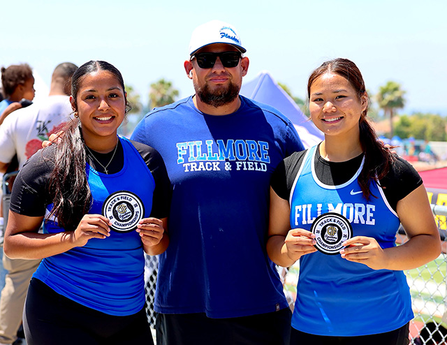 Six Flashes track and field members traveled to Yorba Linda to compete in the CIF Southern Section Division 3 Prelims and placed in multiple events. These athletes placed in the Girls 4x100m relay, Boys & Girls discus/Shot put and Jumpers events. Pictured (l-r) are: Hermelinda Ocegueda, Coach Anthony Tafoya, and Adrianna Deleon, Throwers at CIF Prelims Division 3 event. Adrianna qualified for CIF Finals and will compete this Friday, May 16th at Moorpark HS. Photo credit Coach Anthony Chavez.