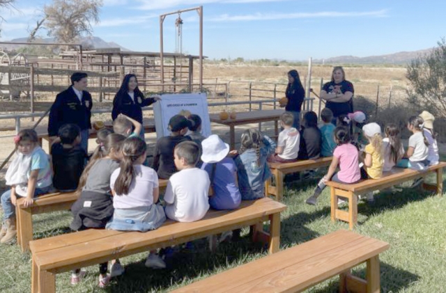 A group of our chapter members leading our pumpkin science station educating the kids about pumpkin parts. Photos credit Della Alamillo, FFA Reporter.