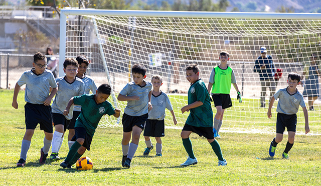 This week’s AYSO soccer photos feature games played Saturday, October 3, including the Boys 5U, Boys 8U and Girls 12U divisions. Above is action from the Boys 8U Grey Reapers game; the opponent and final score were unavailable. The below photo is from the Boys 5U matchup between the Green Hulks and Blue Thunder. No score is kept for this age group. Photo credit Crystal Gurrola. 