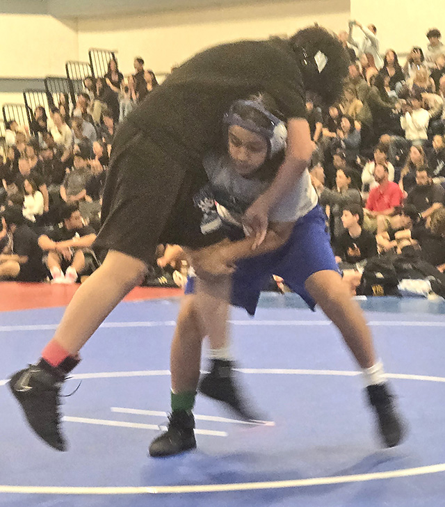 On Thursday, March 5, Fillmore Middle School Wrestling team took on Isbell Middle School in Santa Paula for the season opening of the Ventura County Middle School Takedown Tournament taking on multiple teams. Above is FMS Bulldog Torrey Morales during his match. Photo credit Michael Torres.
