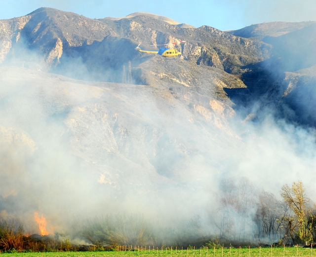 Last Saturday at around 7:30 a.m. a fire broke out in the Santa Clara riverbed. The fire burned about 5 acres, but was contained by 10:00 a.m., even with the Santa Ana winds. Several fire departments and other agencies were called out including a helicopter to help extinguish the flames.