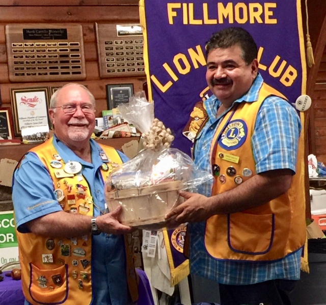David Hubbard, the District Governor for Lion’s District 4A3, paid a visit to the Fillmore Lion’s Club. Pictured is Fillmore Club President Eddie Barajas (right) presenting Hubbard with a gift fruit basket on behalf of the club members. During his term in office the current District Governor visits all of the clubs in the district. District 4-A3 currently has 36 clubs with 1225 members. Photo courtesy Brian Wilson.
