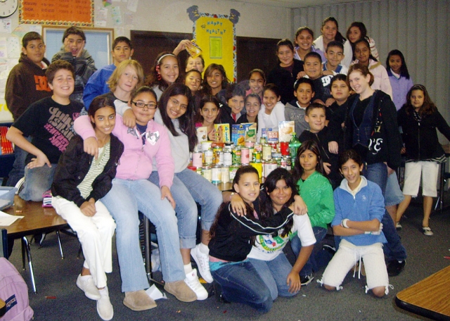 Fillmore Middle School AVID students gathered over 200 cans this Holiday Season! For two weeks the 6th, 7th, and 8th grade students had been competing to see which class could gather the most canned foods. This picture was taken of the 6th grade students, who brought in more than half of the total cans gathered for the food drive. All donation were given to Food Share, to feed the needy this Christmas. Thank you to all students and parents who contributed to this cause.