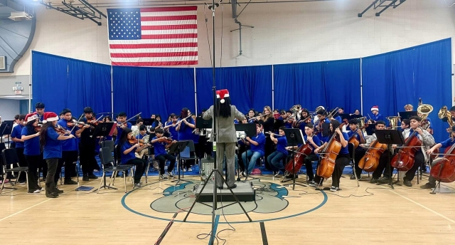 On Thursday, December 12, 2024, the Fillmore Middle School Music Department, under the guidance of Mr. White, held a wonderful winter concert in the school gym for family and friends to attend. Beginning band, symphonic, concert and orchestra all entertained the audience with their holiday music. Thank you to all the parents, boosters and FMS staff who came to support. Courtesy https://www.blog.fillmoreusd.org/fillmore-middle-school-bulldogs-blog/2024/12/12/wonderful-winter-concert.