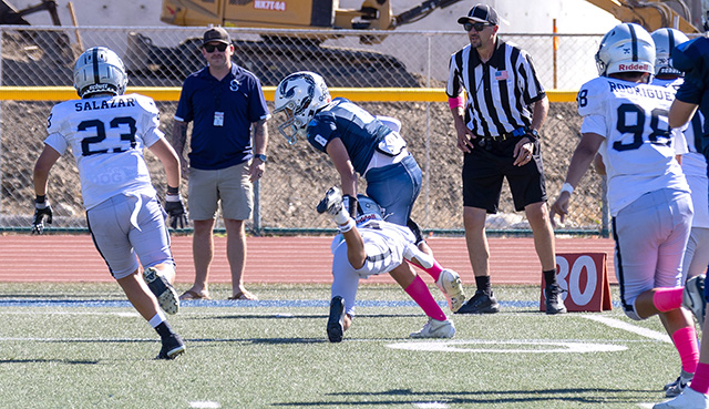 This week’s photos feature the Fillmore Raiders Mighty Mites and Juniors games from this past Saturday, October 3. Above, during the Raiders Juniors game against the Camarillo Stingers, a Raiders player leaps to take down a Camarillo player. The final score was unavailable. Below, a Raiders Mighty Mites player carries the ball as he tries to make his way past the Santa Clarita Grizzlies defense. The Raiders lost to the Grizzlies, 42-2. Photo credit Crystal Gurrola.