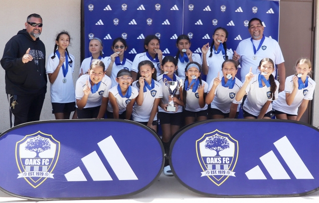 On May 24th – 25th Fillmore’s California United FC 2013 Girls team competed in the Thousand Oaks FC Tournament of Champions and brought home the Championship trophy. Top Row: Head Coach Jose Luis Lomeli, Christine Beltran, Layla Boyett, Aaliyah Cervantez, Sadie Manriquez, Kenya Hernandez, Bella Mendez, Asst. Coach Tony Mendez. Bottom Row: Sarai Prado, Mariannah Arreola, Aixa Lomeli, Toni Cervantez, Itzel Arana, Alessandra Padilla, Siani Lomeli and Hanna Sasson. Photo credit Erika Arana.