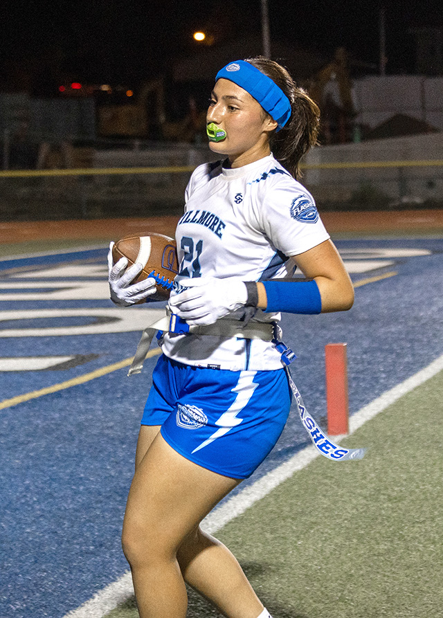 The Fillmore Flashes Girls Flag Football team played well against Cate last week. Pictured above, two FHS players take the field—one scores a touchdown for the Flashes while the other (below) looks to make a pass during the game. Photo credit Crystal Gurrola.