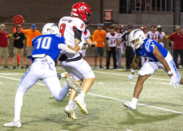 This week, the Fillmore High School Flashes JV and Varsity Football teams faced the Carpinteria Warriors. The Varsity game was held on Friday, September 18, following the team’s Senior Night celebration. Above, Flashes Varsity #10 Jayce Burboa, brings down a Carpinteria player attempting to make a catch during Friday night’s game. Varsity beat Carpinteria 48-0. Below, Flashes JV players converge on a Carpinteria Warrior, bringing the play to a stop. The JV team played Thursday, September 17, earning a 42–14 victory. The Flashes have a bye this week and will return to action October 2 with an away game against San Marcos. Photo credit Crystal Gurrola. 