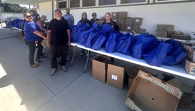 Pictured is a Food Share group organizing a giveaway event by the FUSD/Sespe cafeteria on Monday, May 18th. To locate giveaway information go to https://foodshare.com/findhelp/#findapantry. Photo credit Gazette staff.