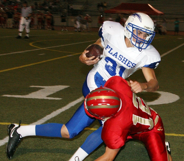 Quinn Keller #31 caught the pass and ran for a couple of yards before being tackled by Village Christian. Keller was brought down within 5 yards of the goal line.