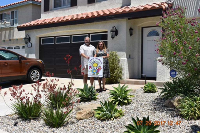 Pictured is July 2017 Yard of the Month winner Gary Esquibel with Fillmore Civic Pride member Ari Larson. Photo courtesy of Fillmore Civic Pride.