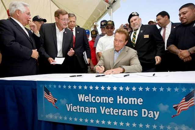 Governor Arnold Schwarzenegger joined Assemblymember Paul Cook (R-Yucca Valley) at the Twentynine Palms Marine Base to sign AB 717 which establishes an annual “Welcome Home Vietnam Veterans Day” on March 30.