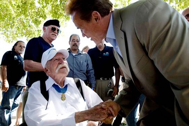 Governor Schwarzenegger meets with veterans of the Vietnam War.