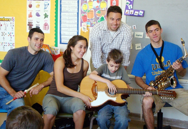 Michael in Room 9 at San Cayetano is very excited to be in the company of the well known Los Hermanos Herrera. Los Hermanos Herrera made a special appearance at the request of their Mother Oralia Herrera who was a substitute teacher in Room 9. Mrs. Herrera realized that the students responded well to music and were fascinated by the instruments so she appealed to her family for a special appearance. The students were able to experience not only the sound of their music but able to experiment with the musical instruments. A big thank you to both Los Hermanos Herrera and Mrs. Herrera. San Cayetano appreciates their dedication to our students.