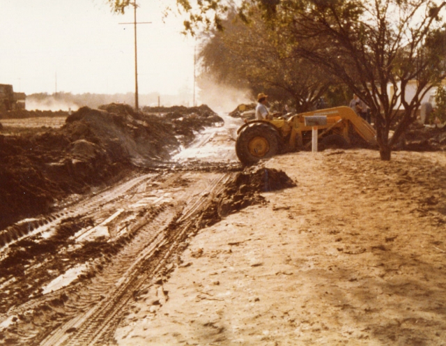 Highway 126 & Rhodes Ct. (the highway's frontage road) standing near Tipsy Fox looking West.