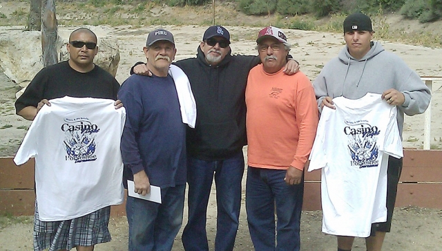 (l-r) are 2nd place winners Ronnie Alcozar and Rusty Ortega, Tournament Coordinator Paul Vaiz, 1st place winners Richard Ruiz & Ricky Ruiz. The 1st Annual FHS Athletic and FFA Booster Club Horseshoe Tournament was held on Saturday April 9, 2011 at Britt Park. There were 8 teams that participated and supported this fundraiser. 1st place winners were Richard and Ricky Ruiz of Fillmore, and 2nd place winners were Rusty Ortega and Ronnie Alcozar of Piru. All winners were awarded prizes and T-shirts. On behalf of the FHS Athletic and FFA Booster clubs we would like to thank Paul Vaiz for his expertise and for running our
horseshoe tournament this year. Also thank you to all the pitchers Rodney Schrock and Randy Lemons, Willie Leighton and Michael Boschee, Lawrence and Edwin Boschee, Steve Hope and Richard Molina, Chris Hernandez and Jessie Avila, Ernie and Curtis Holmes.