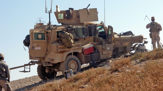 Above a truck was damaged by an IED, a 152 mm artillery shell which blew off the passenger side tire and put a hole in the engine.