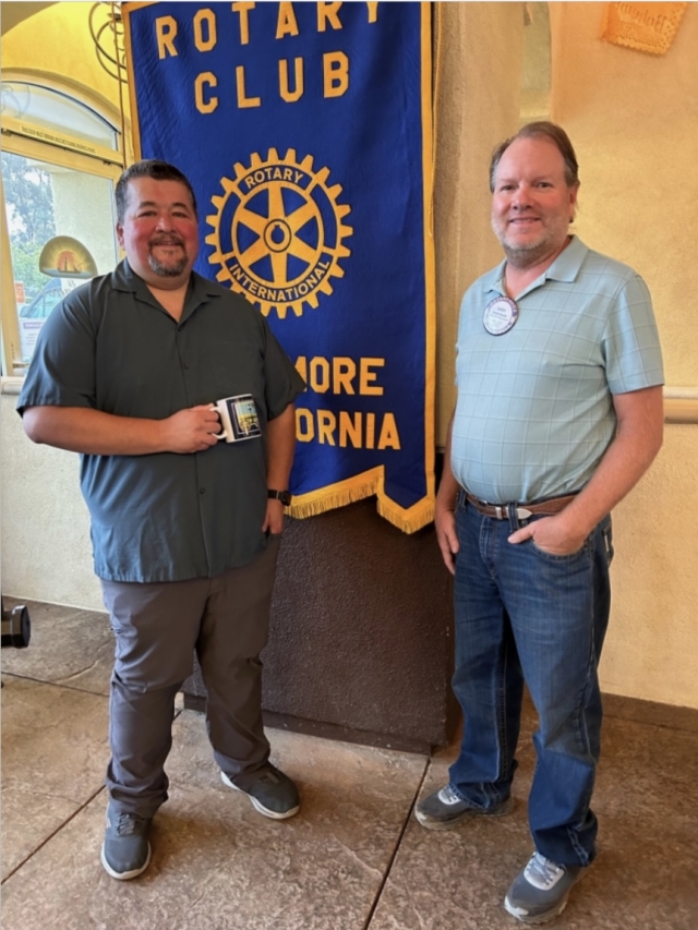Last week’s Rotary program was presented by John Marquez. He is a member of the Santa Paula Rotary and is CEO of the Santa Paula Chamber of Commerce. John is a member of many boards in the county, which makes him aware and informed about what is happening all over. He is always looking for ways we can promote and support our end of the valley and each other. Ventura County is celebrating its 150 Anniversary this year. There will be a big celebration on October 21st, at the Ag Museum, in Santa Paula. Pictured (l-r) are Speaker John Marquez being presented with a Rotary mug from President Scott Beylik. Photo courtesy Martha Richardson.