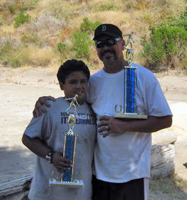 Piru Petroleum held their Annual Melinda Bishop/Bruce Smith Memorial Horseshoe Tournament on Saturday, June 28th at Britt Park. The proceeds from this tournament benefit the club’s scholarship fund. Scholarship recipients for this year were: Bernadette Alamillo, Stephanie Butts and Tenea Golson, Fillmore High School graduates and David “DJ” Wareham a graduate of St. Bonaventure High School. Congratulations to these students. The Horseshoe tournament was well attended and a great time was had by all. A total of 18 teams participated and the winners were Henry Sr. & Henry Jr., (above) father and 11 year old son, last name not avaible at press time. It was their first tournament. Second place went to Victor and Rose Marie Schlau from Lake Hughes; third place went to Kingston Lindsey from Oxnard and his partner Lenny. The 50/50 raffle winner was Cindy Vaiz. Piru Petroleum Club would like to thank all who participated to make the day so successful, especially Paul Vaiz for running the tournament. Piru Petroleum Club meets on the 2nd & 4th Friday of each month except December and has Family Night dinners on the 3rd Thursday of each month except November & December. Everyone is welcome to attend. Courtesy of Piru Petroleum.