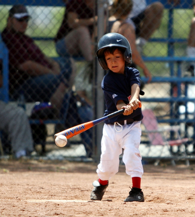 Miguel Lagunas (Red Sox Coach Pitch) concentrates on hitting the ball, last Saturday.