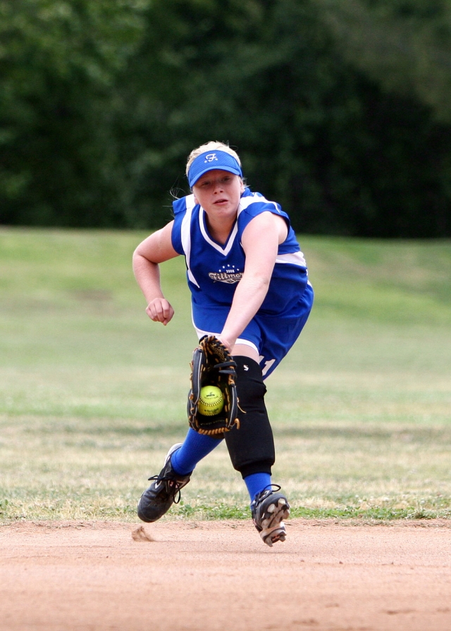 Sarah Scott (10& Under Allstars) makes a great catch during the game, Scott also hit a double with bases loaded to help win the game against Northridge.