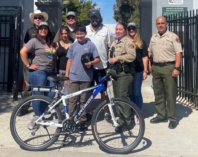 The Fillmore Middle School administration team nominated incoming 7th grade student Ernesto Martinez as recipient of a new bike donated by the Fillmore Sheriff’s Department. Ernesto was nominated due to the social and academic growth that he exhibited throughout his 6th grade year at the middle school. Deputy Yolanda Avila presented Ernesto with the bike and had the following to say, “At times some students have a challenging time due to various factors. It is our responsibility and duty to work with students who have struggles and guide them through these rough patches. With support, compassion and empathy, students are able to understand that this is a safe space in which they are an individual for whom people care. Ernesto Martinez was such an individual. With the support and understanding he experienced this year, Ernesto thrived and rose to the challenge. Ernesto continues to do well academically and has made great strides in all other aspects of the challenges of middle school. Ernesto continues to persevere, and we are proud to see his personal growth and success this school year.” Courtesy https://www.blog.fillmoreusd.org/fillmore-middle-school-bulldogs-blog/2023/7/25/school-resource-officer-bike-donation.