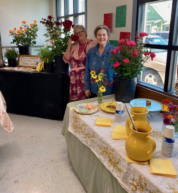 Left is Regina Stehly Nunez who always does the Flower Show Cafe and on the right is Doris Nichols who brought all her Middle School students art work for display.