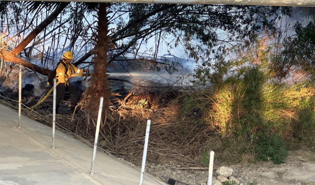 A vegetation fire started on Friday, August 11th, at 7:00pm, under the Chambersburg/23 Bridge, by the bike path. Crews worked quickly to get it under control, and the bridge was closed to through traffic until approximately 10:45pm. At least eight units responded, including Fillmore City Fire and Ventura County Fire. The fire started in proximity to a homeless encampment and spread by embers from three ignited Palm trees. One acre was burned. This is the third fire in that area commonly caused by fires built in the camps for cooking or staying warm, and perhaps drug use, according to Fillmore Fire Chief Keith Gurrola. A fourth fire was ignited by 2 Rivers Park a couple of months ago, under investigation. Restitution for fire personnel cannot be collected in these incidences, with the burden falling on taxpayers. Chief Gurrola stated that he is pursuing a grant in conjunction with the Ventura County Fire Department for “hazard reduction” from an approximately $3 million Ventura County Fire Safe Council/Cal Fire (CA Dept. of Forestry & Fire Protection) grant, part of a state-wide $113 million wildfire prevention grant. See details below.

