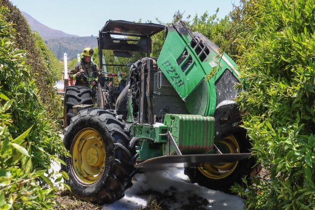 On Friday, July 11th, at 12:05 p.m., the Ventura County Fire Department was dispatched to a reported vehicle fire in the 500 block of Guiberson Road, Bardsdale. Arriving firefighters located a tractor fully engulfed in flames in between the orchards. Firefighters were able to extinguish the fire with the assistance of Fillmore City Fire Department. Cause of the fire is under investigation. Photo credit Angel Esquivel.