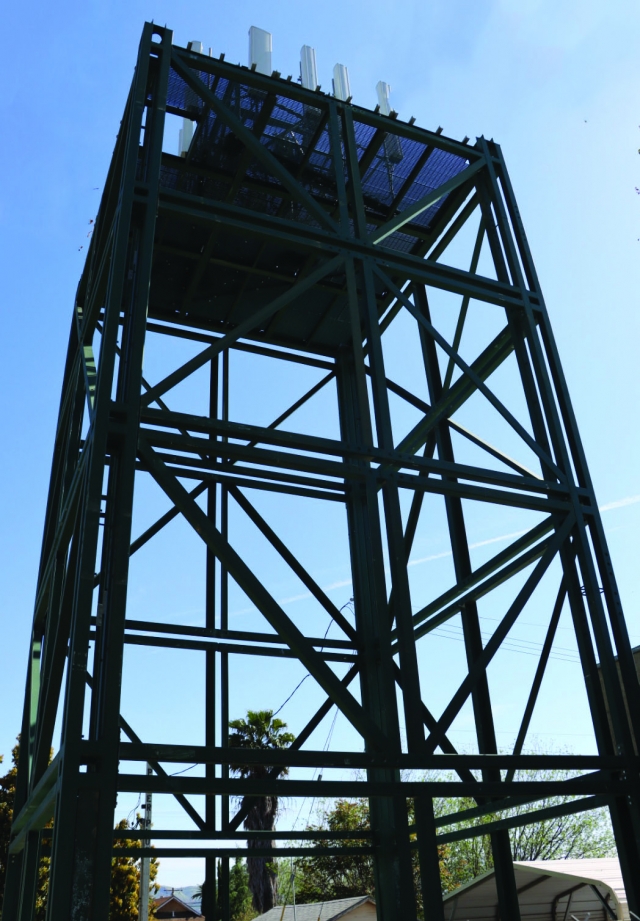 The AT&T Corp. antenna support structure along the bike path just north of the 500 block of Santa Clara St. is taking shape. In 2020, the Applicant, Eukon Group, on behalf of AT&T Corporation, requested a permit to construct and to operate an AT&T wireless/cell tower facility. The facility consists of a 65-foot -inch antenna support structure with the architectural treatment of a hip roof that extends 2.9 feet above 65’, ground mounted equipment, and back-up generator surround by a 6’ in height block wall. It is located at 563 Santa Clara St. adjacent to the railroad right of way. The antenna support tower structure contains the antenna panels and radio units. A concrete slab on grade provides support for the ground mounted equipment. The tower will be camouflaged when completed, according to City Planning Director Kevin McSweeney. Photo credit Angel Esquivel-AE News.