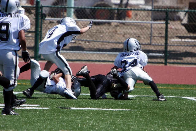 Damian Gonzalez finishes off an opposing ball carrier.
