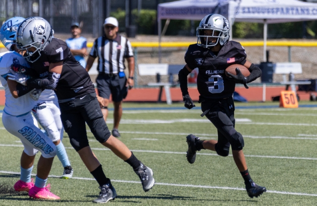 On Saturday, August 26, the Fillmore Raiders Youth Football and Cheer started their 2023 football season. Pictured are the teams who hosted games at Fillmore High football stadium. Pictured below is Raiders Junior #3 as he makes his way up the field with teammate #7 clearing the way in their game against the Saugus Navy. Photos courtesy Crystal Gurrola. 