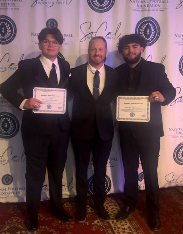 Pictured (l-r) are National Football Foundation Hall of Fame Inductee Sergio Torres, Fillmore High School Head Football Coach Charlie Weis, and National Football Foundation Hall of Fame Inductee David Jimenez. Photo courtesy Fillmore Unified School District Blog.