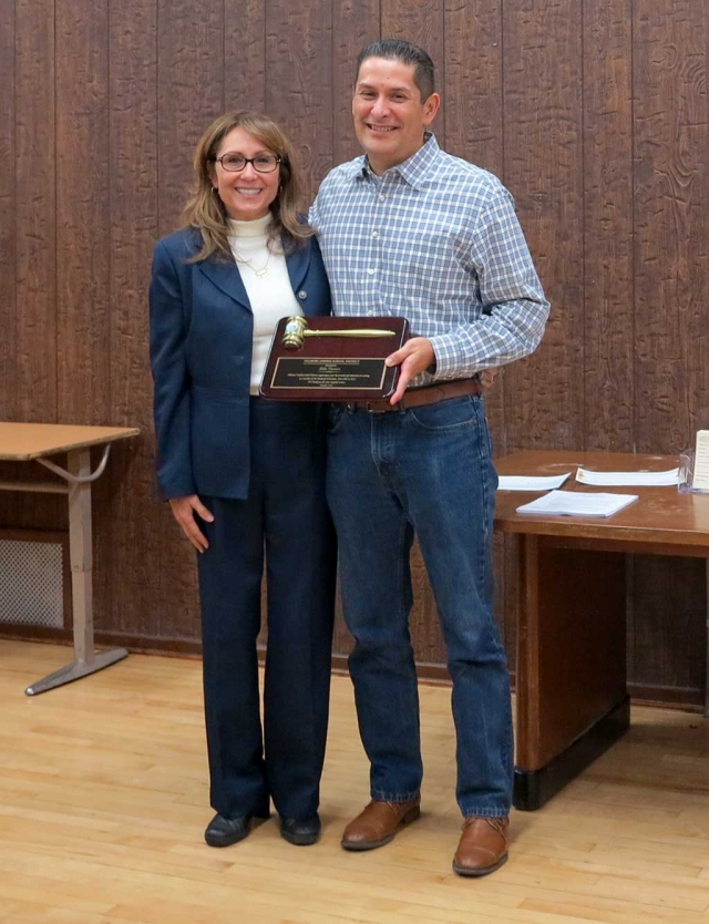 (l-r) Board President Virginia de la Piedra and John Garnica. The Fillmore Unified School District School Board presented John Garnica with a plaque in appreciation of his years of service on the Board. Garnica recently resigned when his wife Beverly was appointed as the Principal of Rio Vista Elementary School effective Monday, October 19, 2015. 