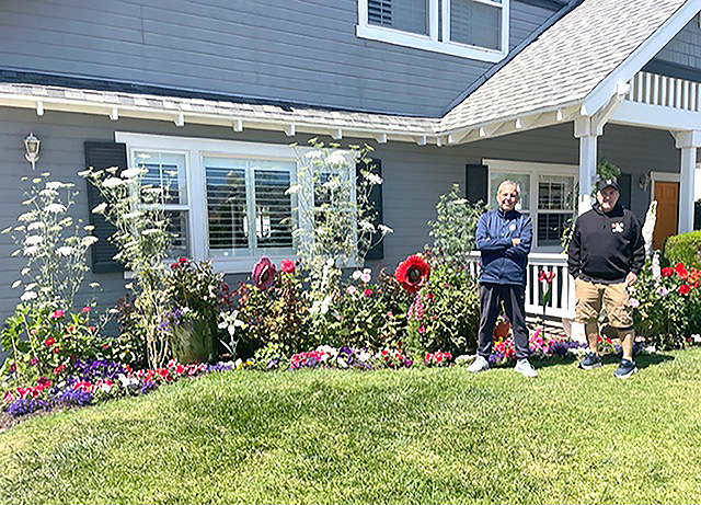 Fillmore Civic Pride volunteers have selected the 2026 June “Yard of the Month” winner. Pictured is Brett Battles, right, in front of his home in the 500 block of Kensington along with his renter Mark Ortega, who asked Brett if he could do some yardwork for him and was given free reign. Photo credit Linda Nunes.