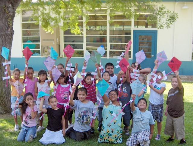 Third grade students at San Cayetano School have started reading stories with friendship as a theme. We read the story: Gloria Who Might Be My Best Friend by Ann Cameron. Through a series of small events, two young children begin a friendship. Gloria moves to the same street that Julian lives on. Gloria explains to Julian that if you write your wishes on a piece of paper and put them in the tail of your kite, the wishes will come true if the papers are gone when you bring the kite down. Here are Mr. Kwit’s third grade students with the kites and wishes that they made. Wishes ranged from “I wish Fillmore was sparkly clean!” to “I wish my family was rich!”